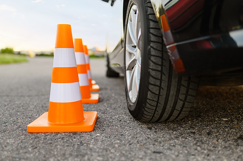 car-and-traffic-cones-driving-school