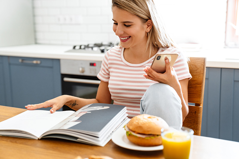 happy customer calling local phone number from business advert in magazine