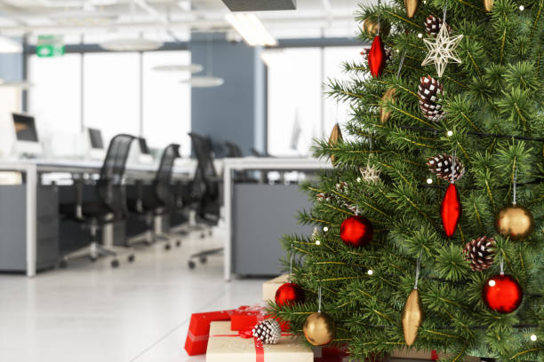 Christmas Tree With Ornaments And Gift Boxes In The Office