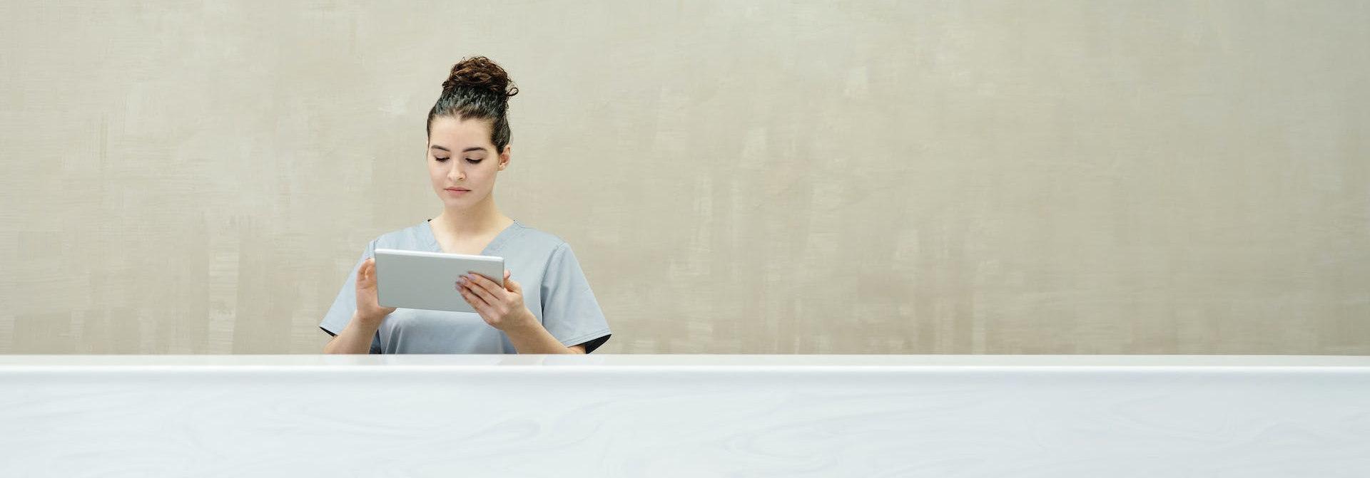 Receptionist behind a business desk